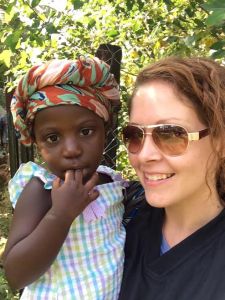 Ashley and her friend's little girl...just a small part of the beloved community she has found in Africa.